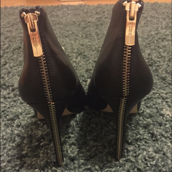 BCBG black pumps with gold zipper on heel