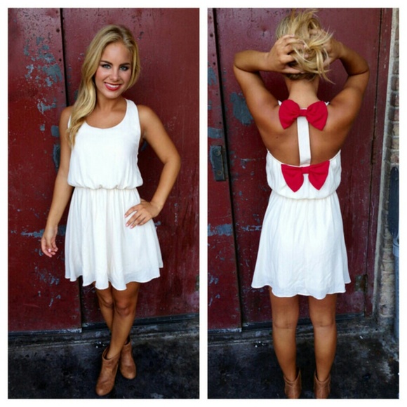 Like New Boutique cream dress with coral bows!