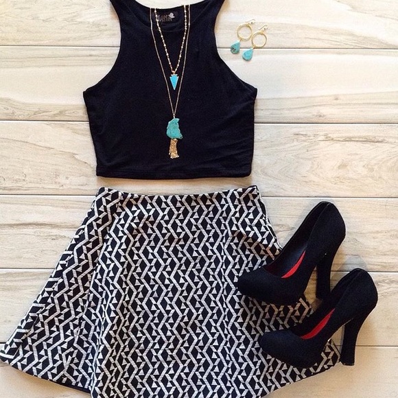 Black heels featuring gold accented back