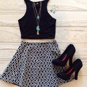 Black heels featuring gold accented back