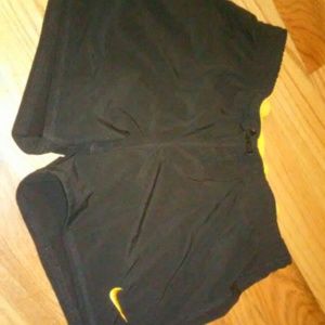 Blue and yellow Nike sports shorts