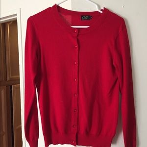 Red cardigan. Red pearl buttons.