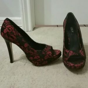 Velika red with black lace platform heels.