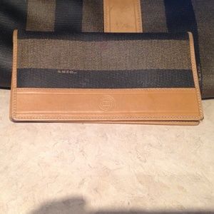 Fendi wallet that can also hold a checkbook.