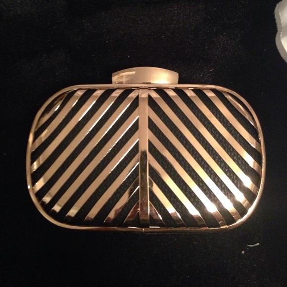 Miztique gold and black small clutch