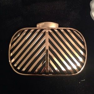 Miztique gold and black small clutch