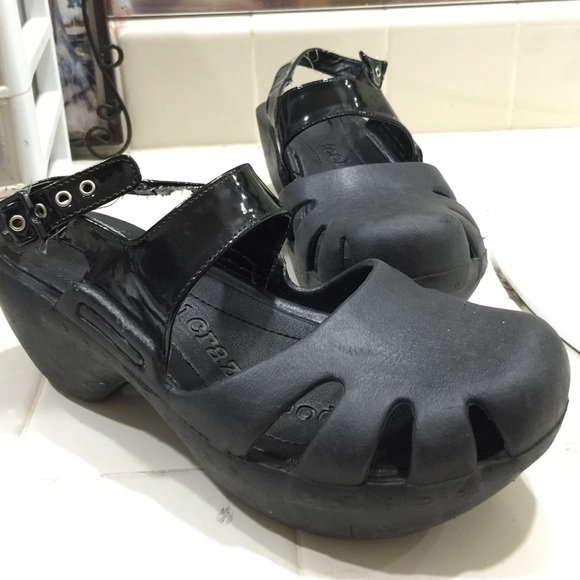 Black Clogs with straps.