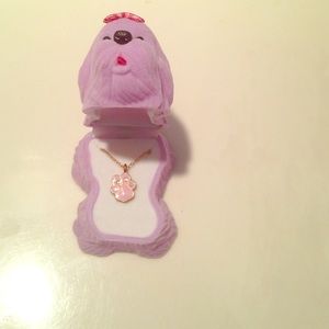 Pink Dog paw necklace inside of Dog holder