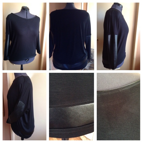 Faux leather detailed black top.