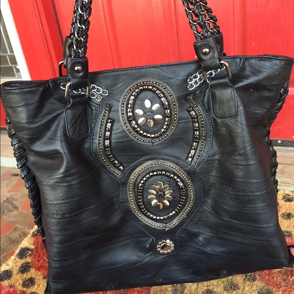 Black hand bag with black and silver design
