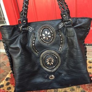 Black hand bag with black and silver design