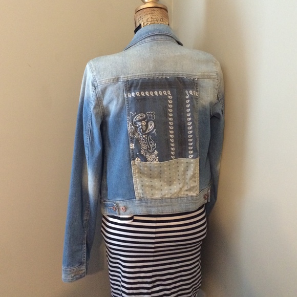 Denim jacket with pop print on the back.