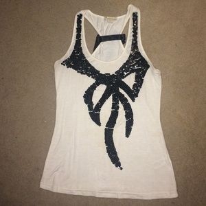Cream razor back tank with sequin& bow