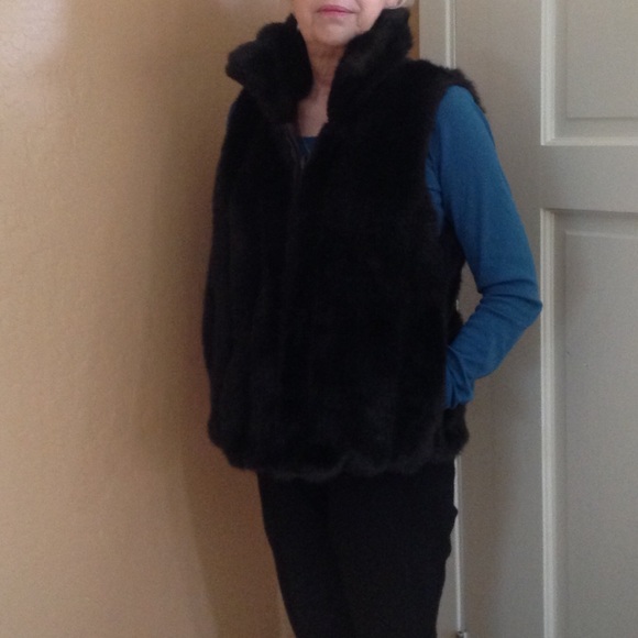 Faux mink chocolate zip front vest with pockets.