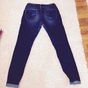 Silver, dark wash, long jeans.