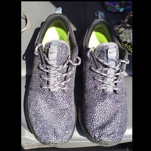 Black and Grey and White Nike Roshes .