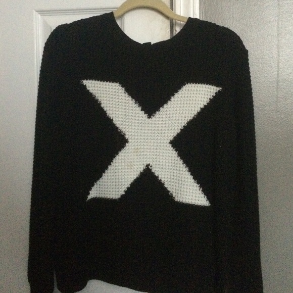 Black sweater with white x