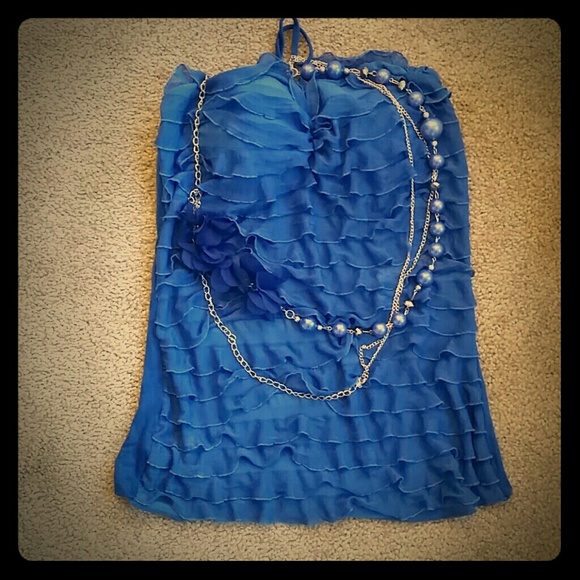 Blue sleeveless top with necklace