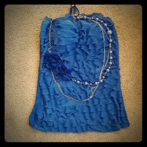 Blue sleeveless top with necklace
