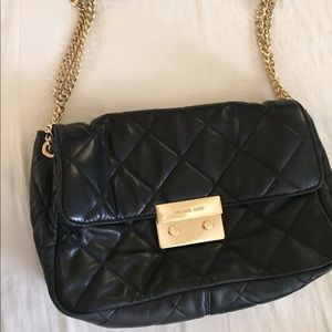 Black Michael Kors quilted bag