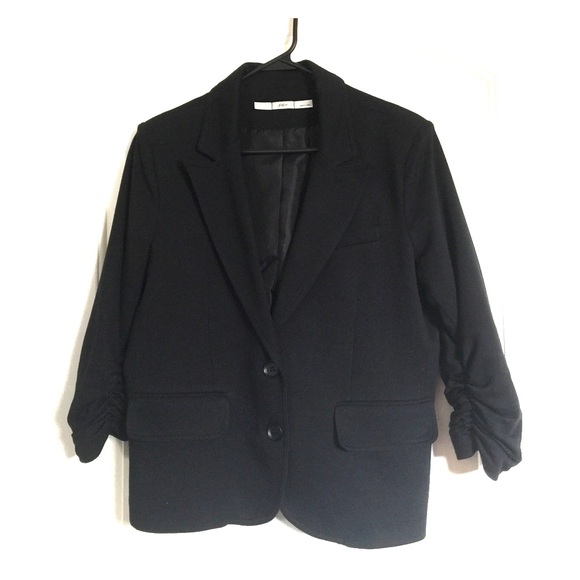 Cute black blazer.