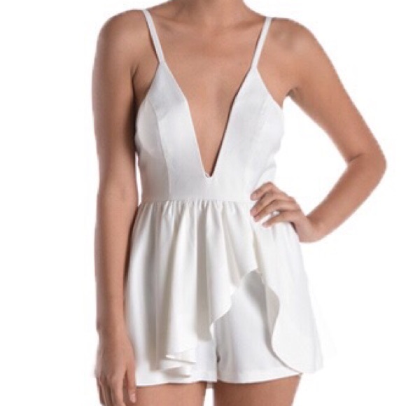 Peplum romper in Off White. size: Small