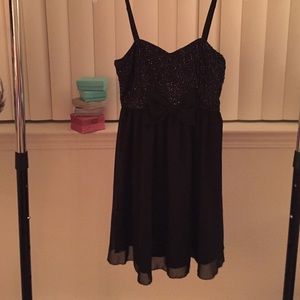Little black dress with sparkles and a bow!