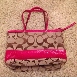 Coach purse with pink stripe