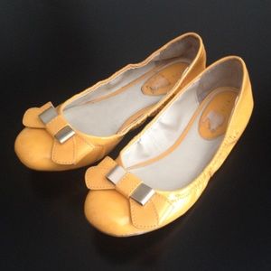 Yellow flats with bow