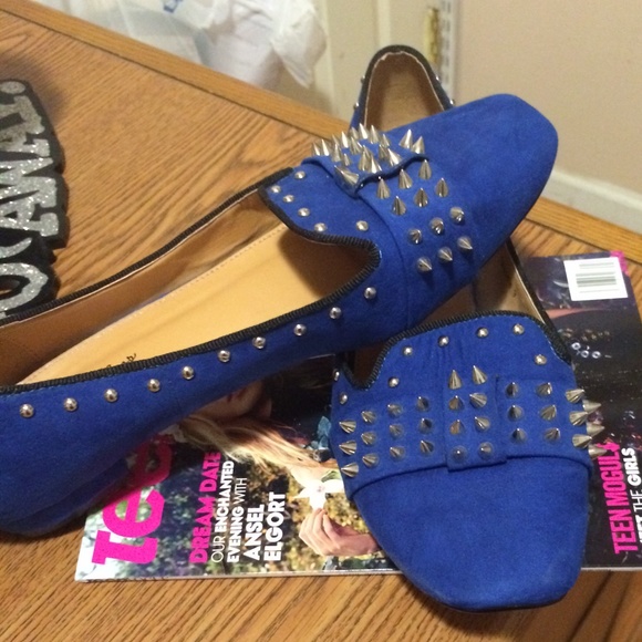 Spikes and studs on suede flats