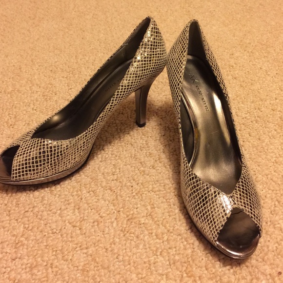 Anne Klein silver snakeskin peeptoe shoes.