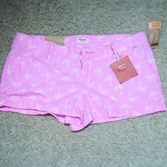 Hot pink shorts with a palm tree design