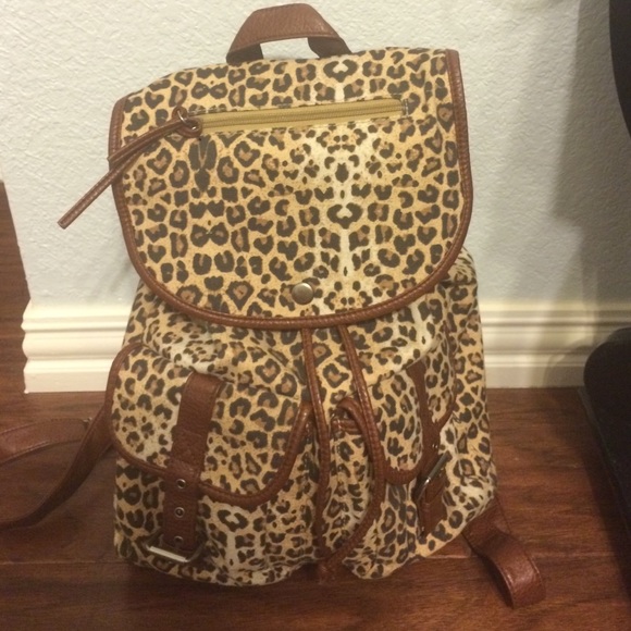 Cheetah print backpack with leather straps