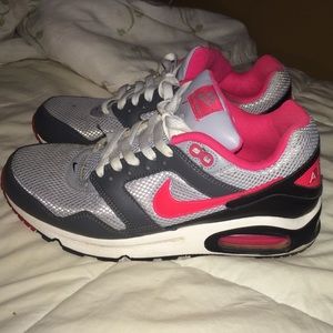 Black, gray, and pink Nike Air Max sneakers