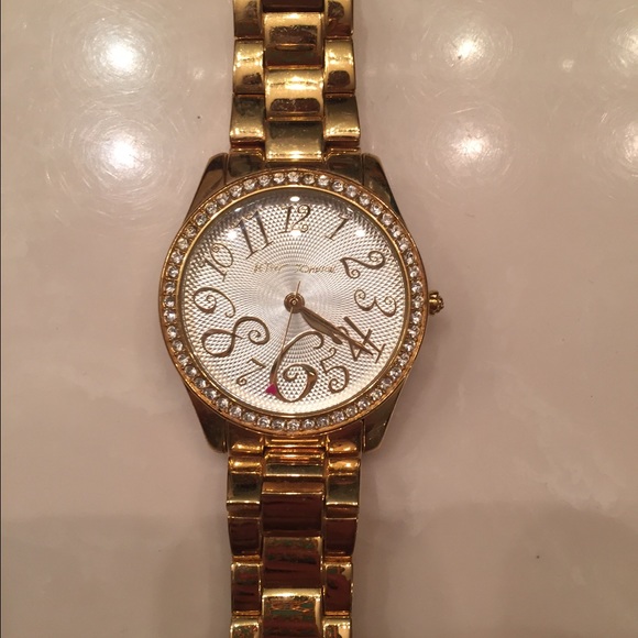 Golden color watch with bling
