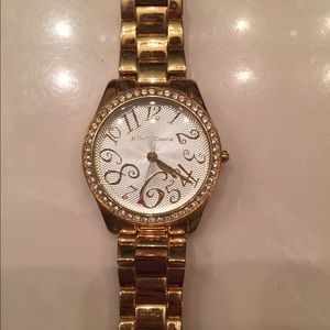 Golden color watch with bling
