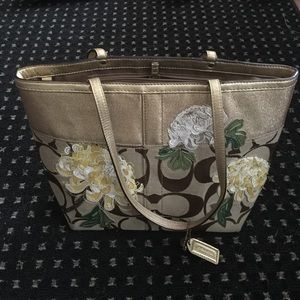 brown and gold flower print coach tote