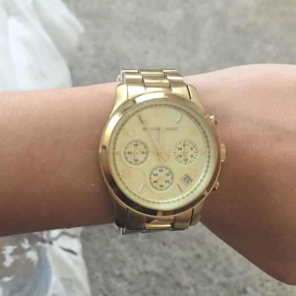 Michael kors gold small faced watch