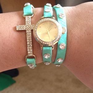 Never worn, teal and cross wrap around watch