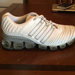 White and silver Adidas tennis shoes