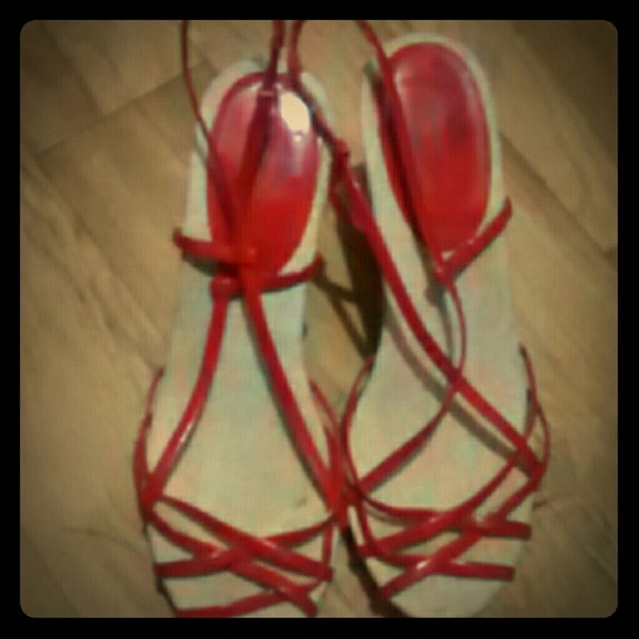 Red strappy heels.