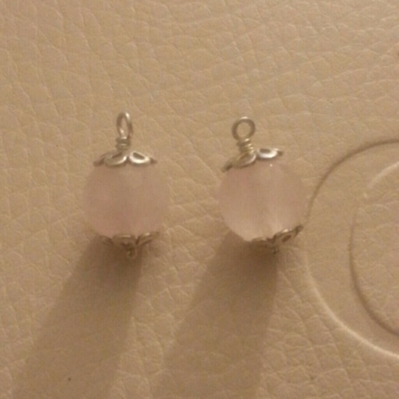 Retired PANDORA rose quartz trinity earrings.
