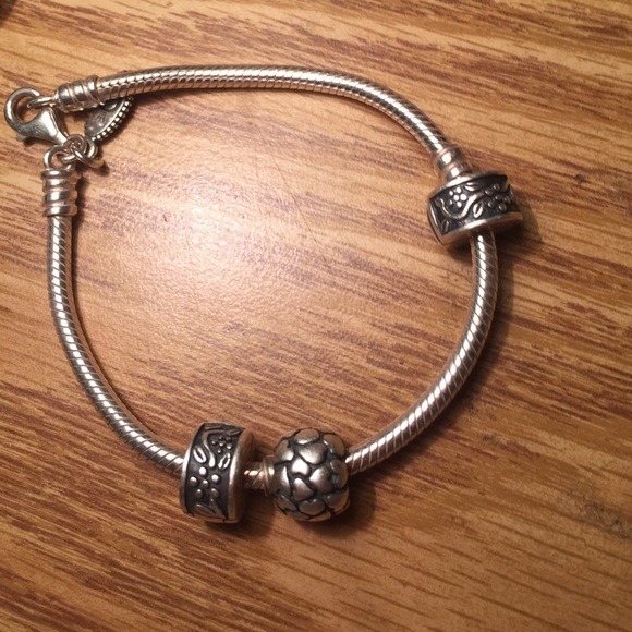 Two Pandora charm stopper/spacer clips