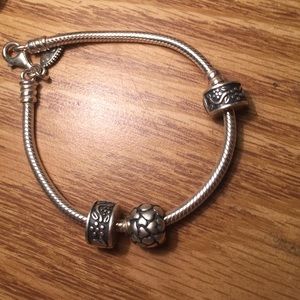Two Pandora charm stopper/spacer clips