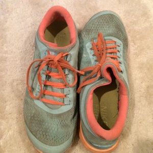 Orange and blue nike free runs