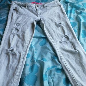 Distressed/torn light blue jeans.