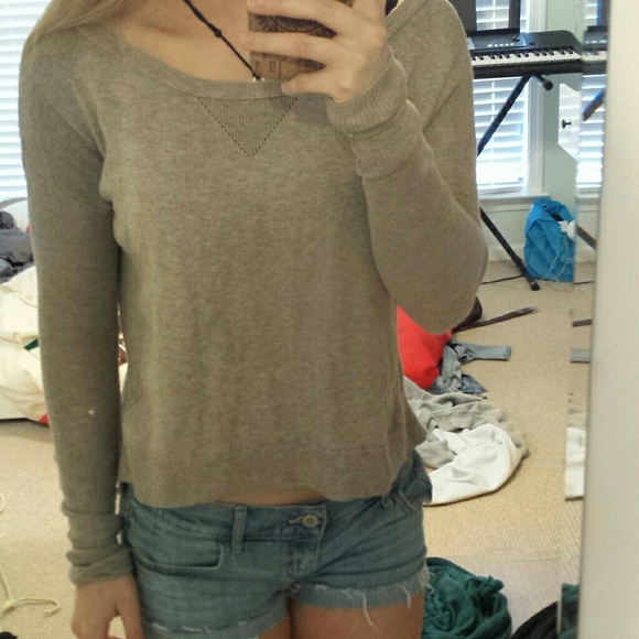 Greyish colored sweater
