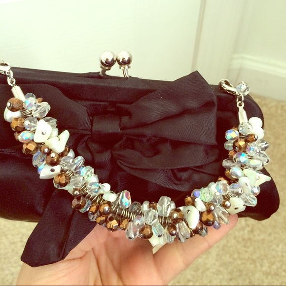 Beaded handle satin clutch