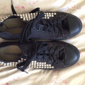 All black low top studded converse