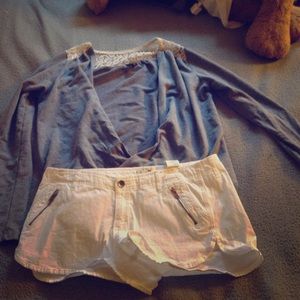 Gray wrap with lace on shoulders.